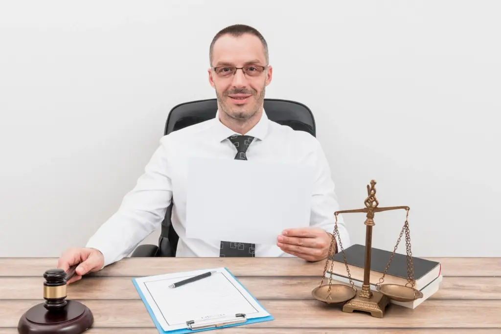 Civil Litigation Lawyer Sydney Holding A Document At The Desk