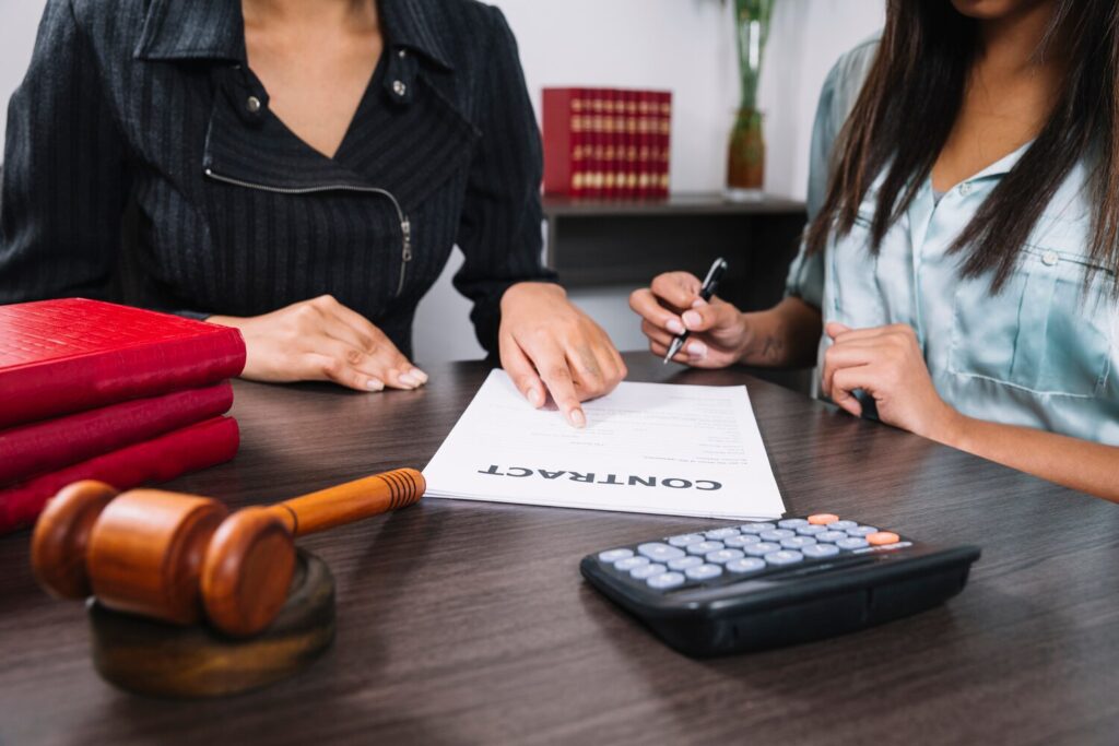 Client Signing A Contract With Legal Documents Alongside An Insurance Lawyer Sydney During A Professional Legal Consultation